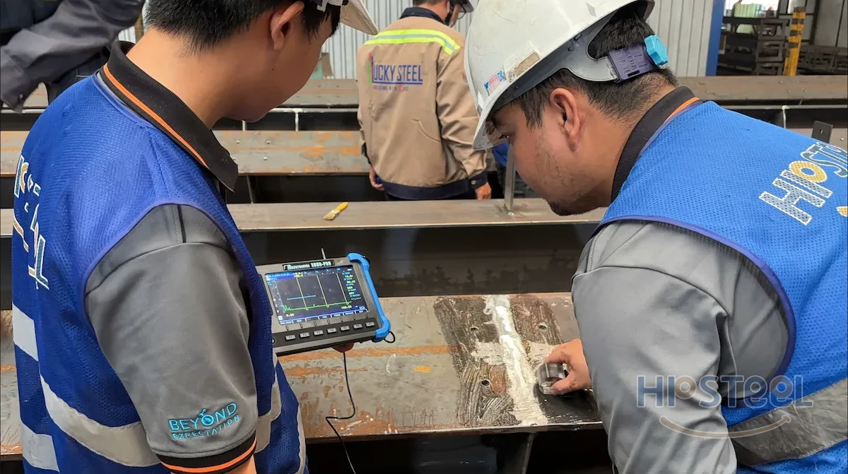 HP Steel QA/QC engineer inspecting a structural steel weld